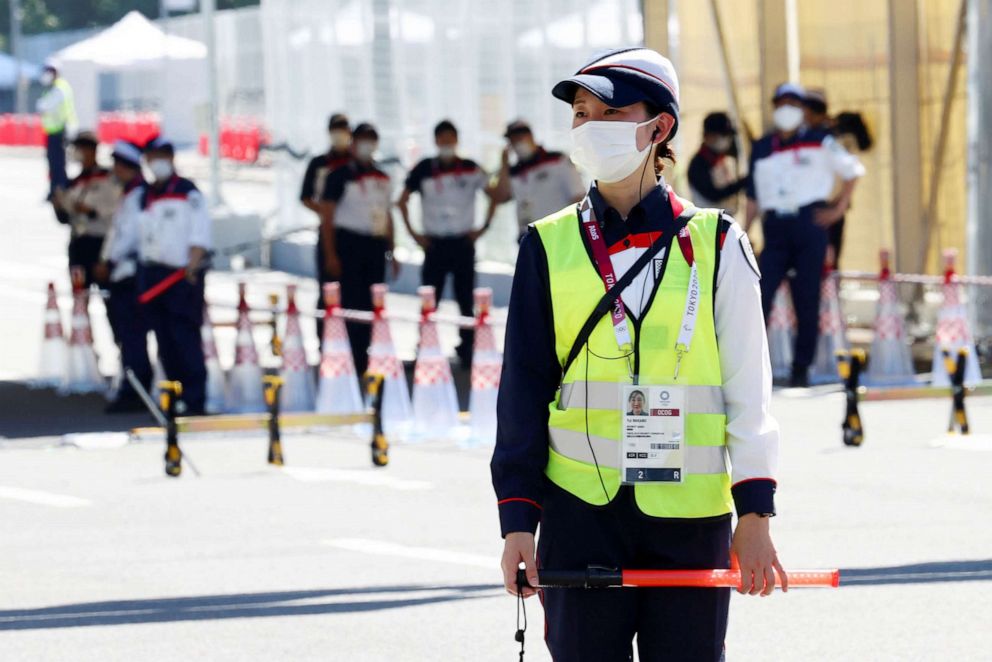 PHOTO: Security staff stands guard at the entrance of the Athletes Village, where a person has tested positive for COVID-19, ahead of Tokyo 2020 Olympic Games in Tokyo, Japan July 17,  2021. 