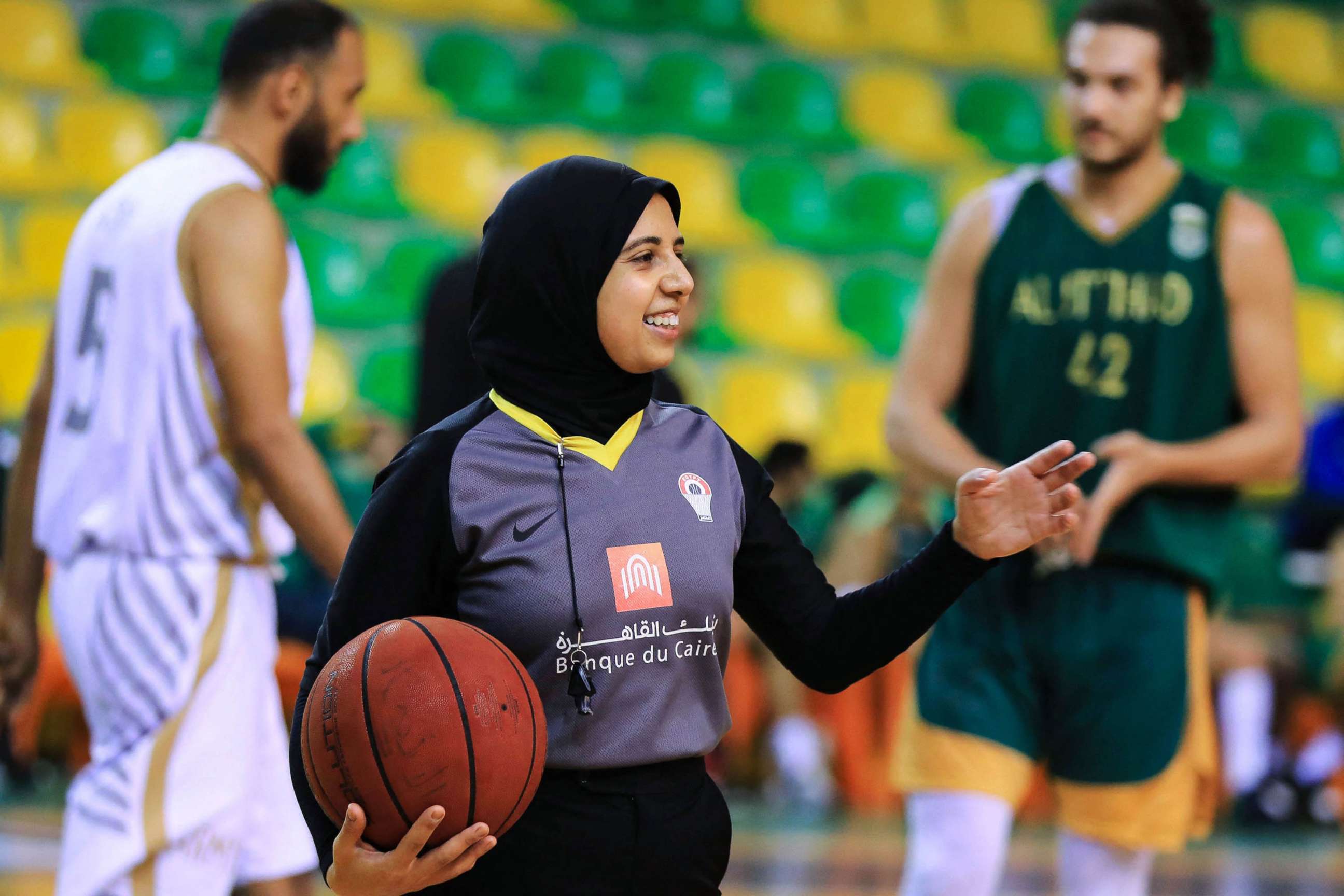 PHOTO: Egyptian Basketball referee Sarah Gamal gestures while holding a ball during a game in Alexandria, Egypt, April 17, 2021.