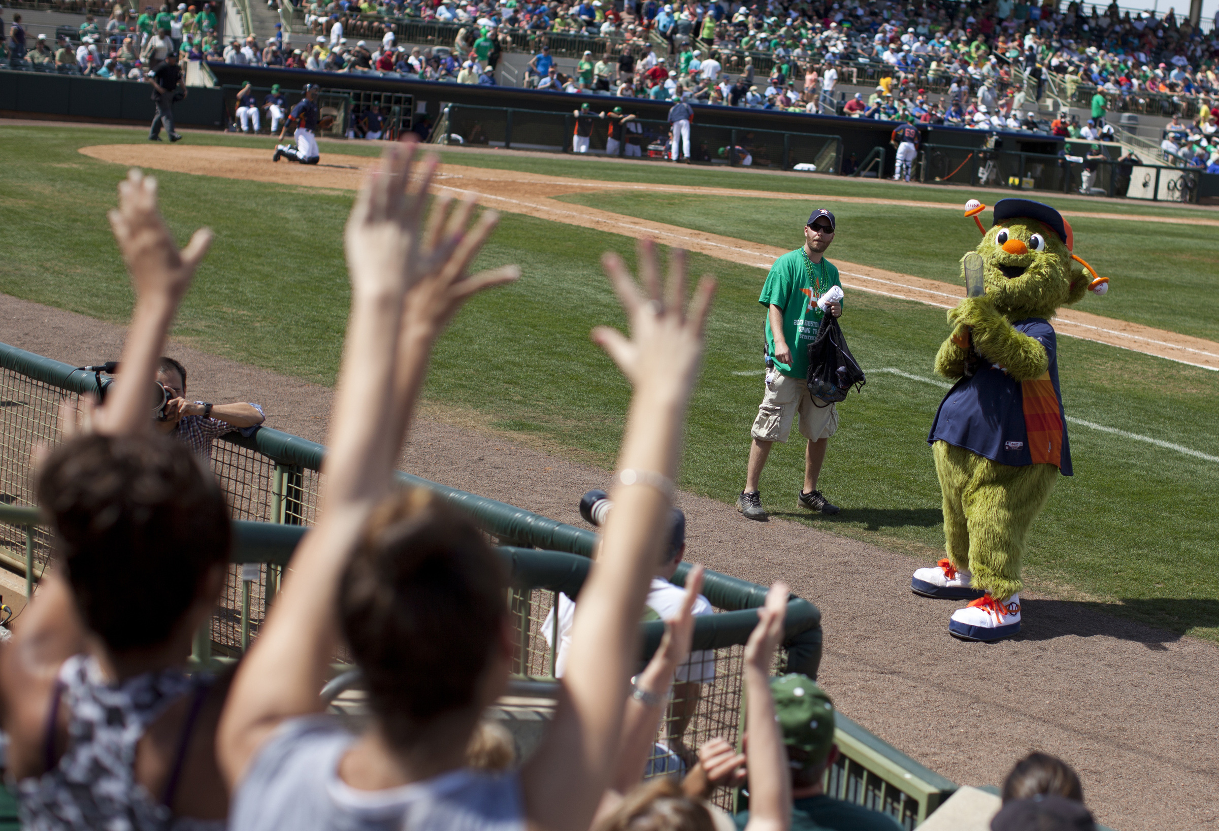 PHOTO: FILE - In this March 17, 2013, file photo, Orbit, the Houston Astros' mascot, fires a T-shirt gun during the sixth inning of the team's spring training baseball game against the Toronto Blue Jays in Kissimmee, Fla.  