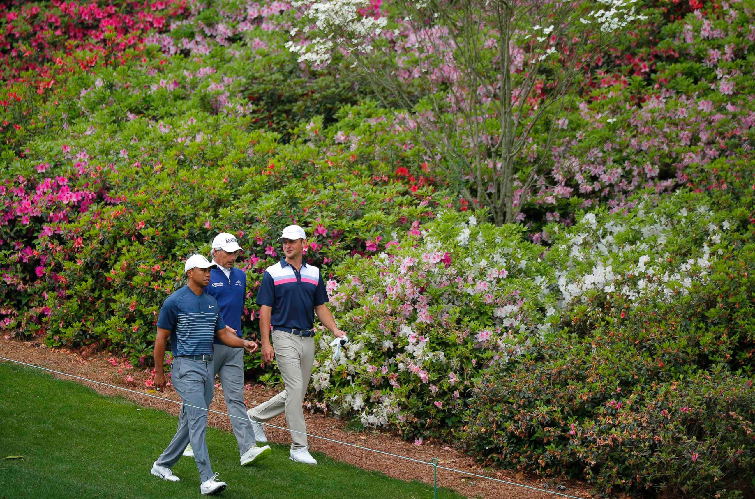 PHOTO: Tiger Woods, Fred Couples and Matt Parziale walk to the 6th green during the final day of practice, April 4, 2018, at Augusta National Golf Club in Augusta, Georgia.