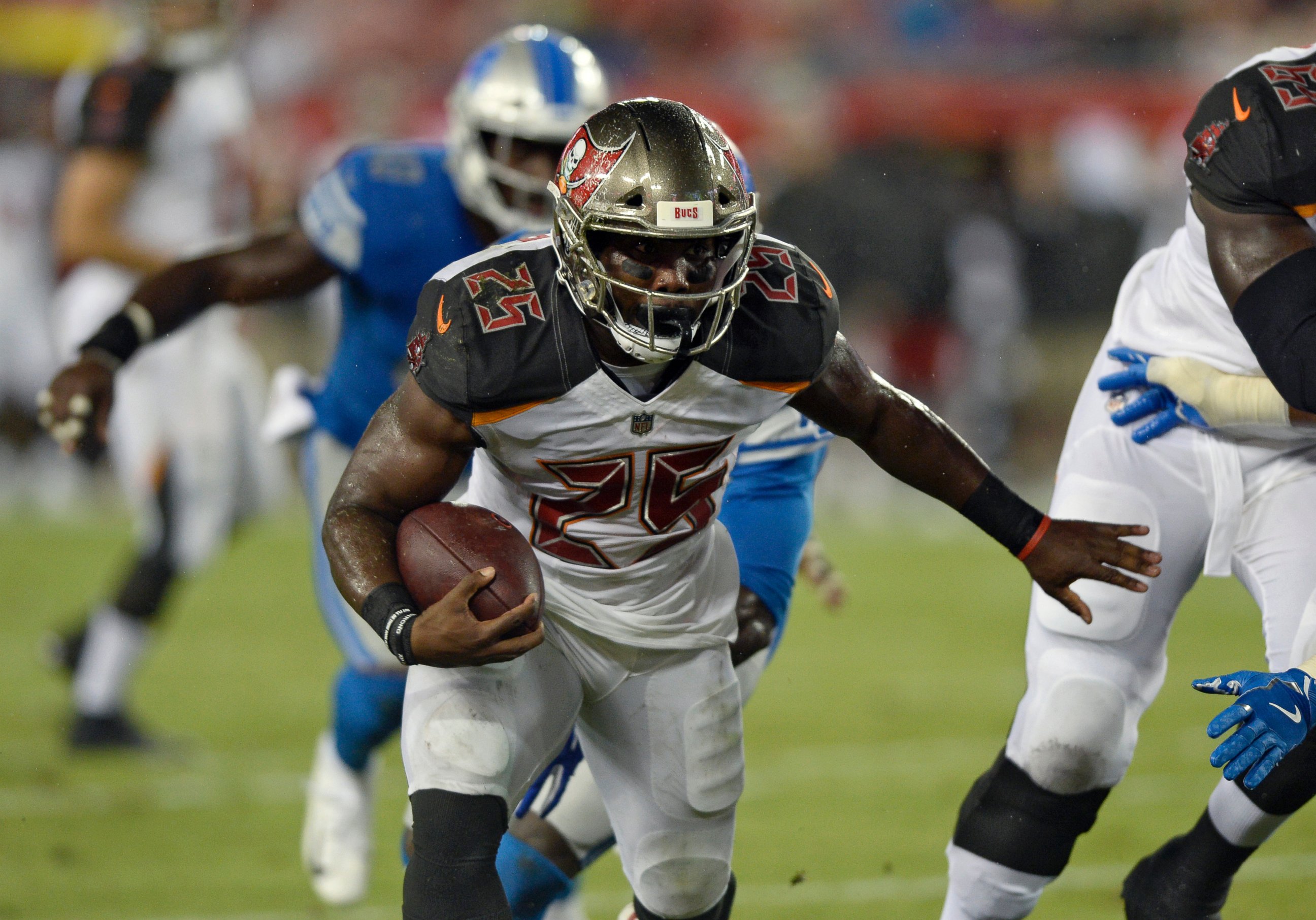 PHOTO: Tampa Bay Buccaneers running back Peyton Barber (25) runs 14-yards for a touchdown against the Detroit Lions during the first half of an NFL preseason football game Friday, Aug. 24, 2018, in Tampa, Fla. 