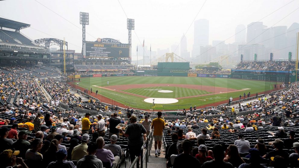 PHOTO: With the baseball game between the Pittsburgh Pirates and the San Diego Padres delayed due to haze from Canadian wildfires fans take their seats at PNC Park in Pittsburgh, Thursday, June 29, 2023.