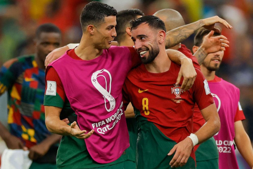 PHOTO: Portugal forward Cristiano Ronaldo and midfielder Bruno Fernandes celebrate after they won the Qatar 2022 World Cup Group H match between Portugal and Uruguay at the Lusail Stadium in Lusail, north of Doha on Nov. 28, 2022.