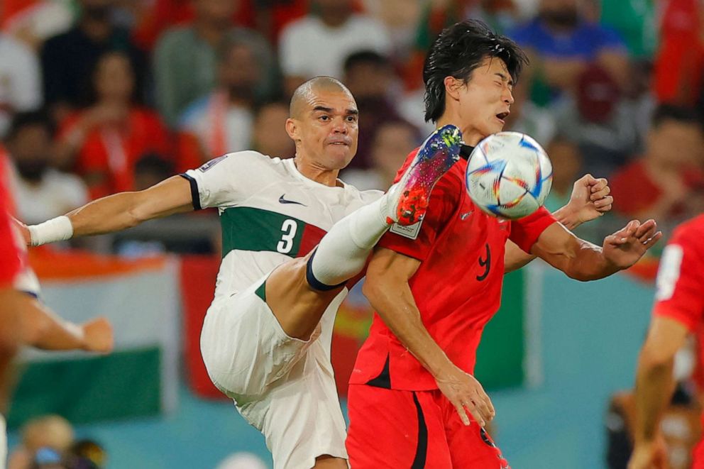 PHOTO: Portugal's defender Pepe fights for the ball with South Korea's forward Cho Gue-sung during the World Cup Group H football match between South Korea and Portugal at the Education City Stadium in Al-Rayyan, west of Doha on Dec. 2, 2022.