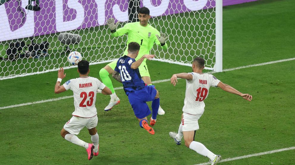 PHOTO: DOHA, QATAR - NOVEMBER 29: Christian Pulisic of United States scores their team's first goal during the FIFA World Cup Qatar 2022 Group B match between IR Iran and USA at Al Thumama Stadium on Nov. 29, 2022, in Doha, Qatar.