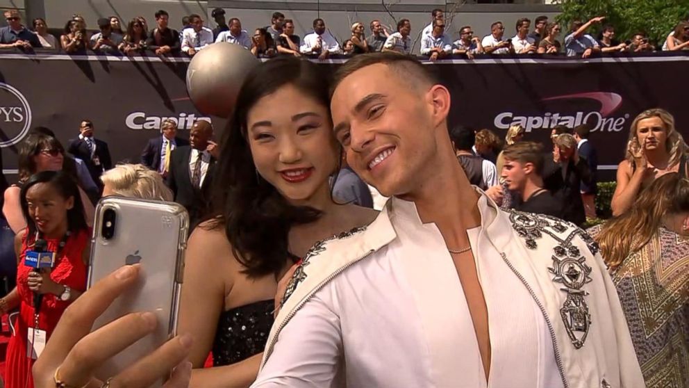 PHOTO: Adam Rippon and Mirai Nagasu snap a selfie together on the 2018 ESPY Awards red carpet. 