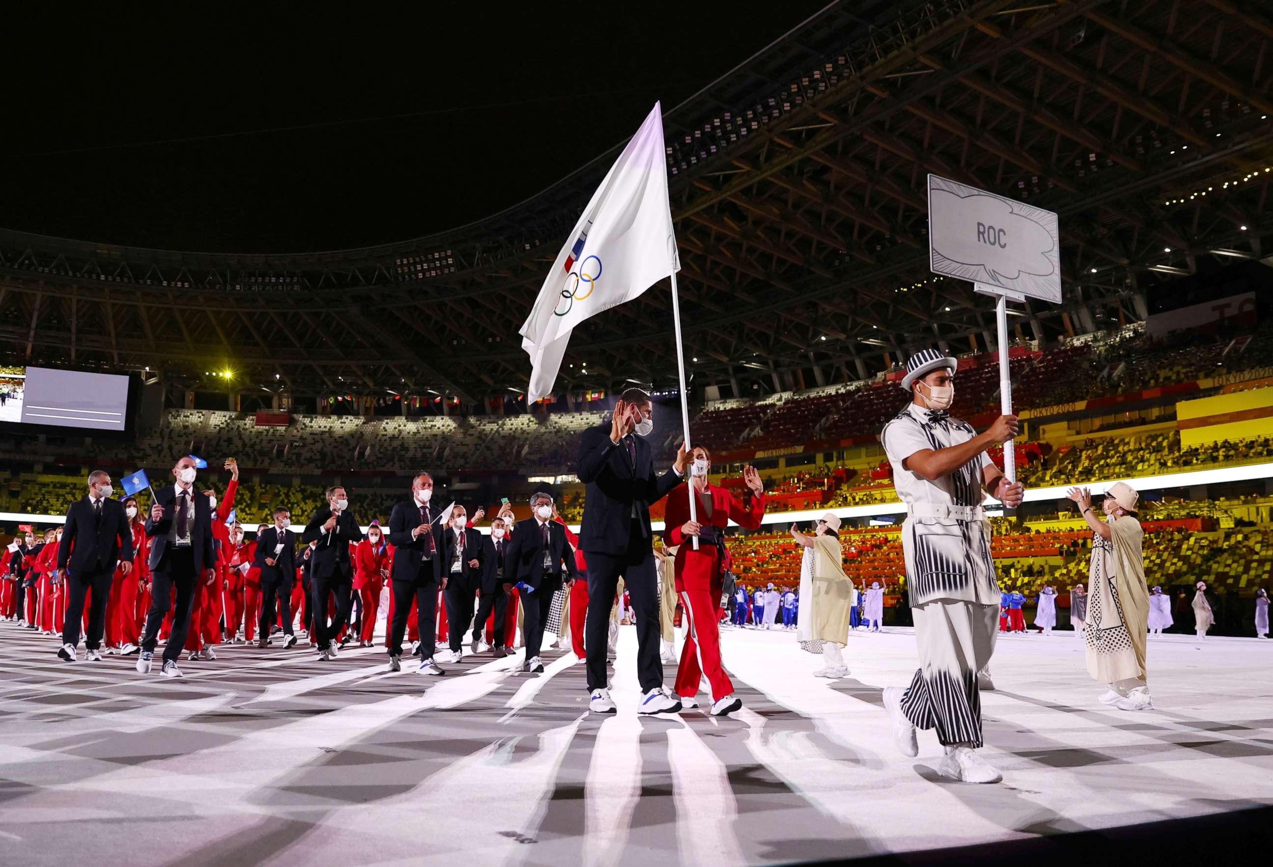 PHOTO: Flag bearer Sofya Velikaya, of the Russian Olympic Committee, leads her contingent during the athletes' parade at the opening ceremony of the Tokyo 2020 Olympics, July 23, 2021.