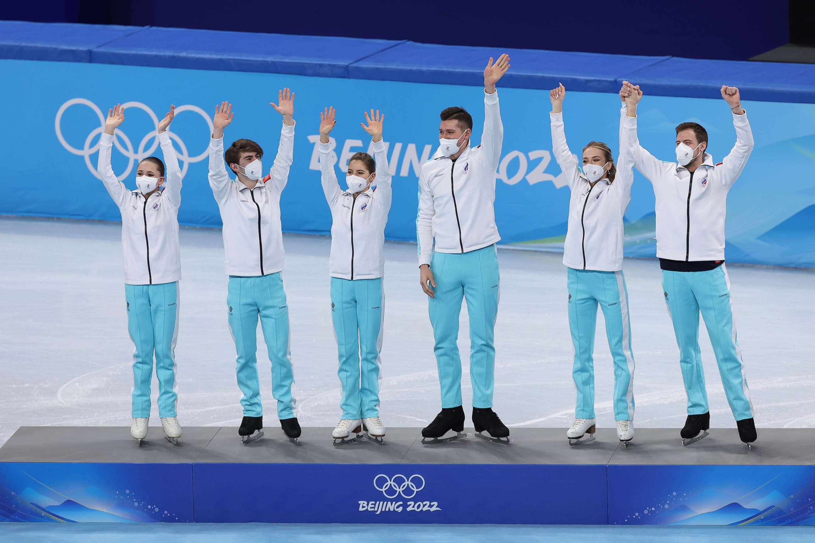 PHOTO: Gold medalists Team ROC wave during the Team Event flower ceremony on day three of the Beijing 2022 Winter Olympic Games, Feb. 7, 2022, in Beijing, China.