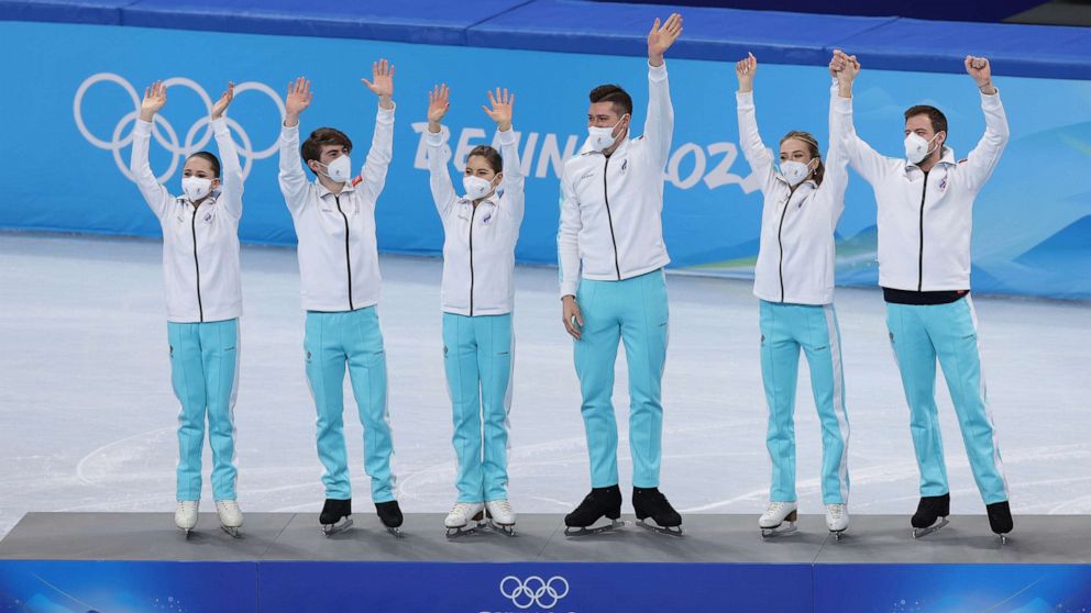 PHOTO: Gold medalists Team ROC wave during the Team Event flower ceremony on day three of the Beijing 2022 Winter Olympic Games, Feb. 7, 2022, in Beijing, China.