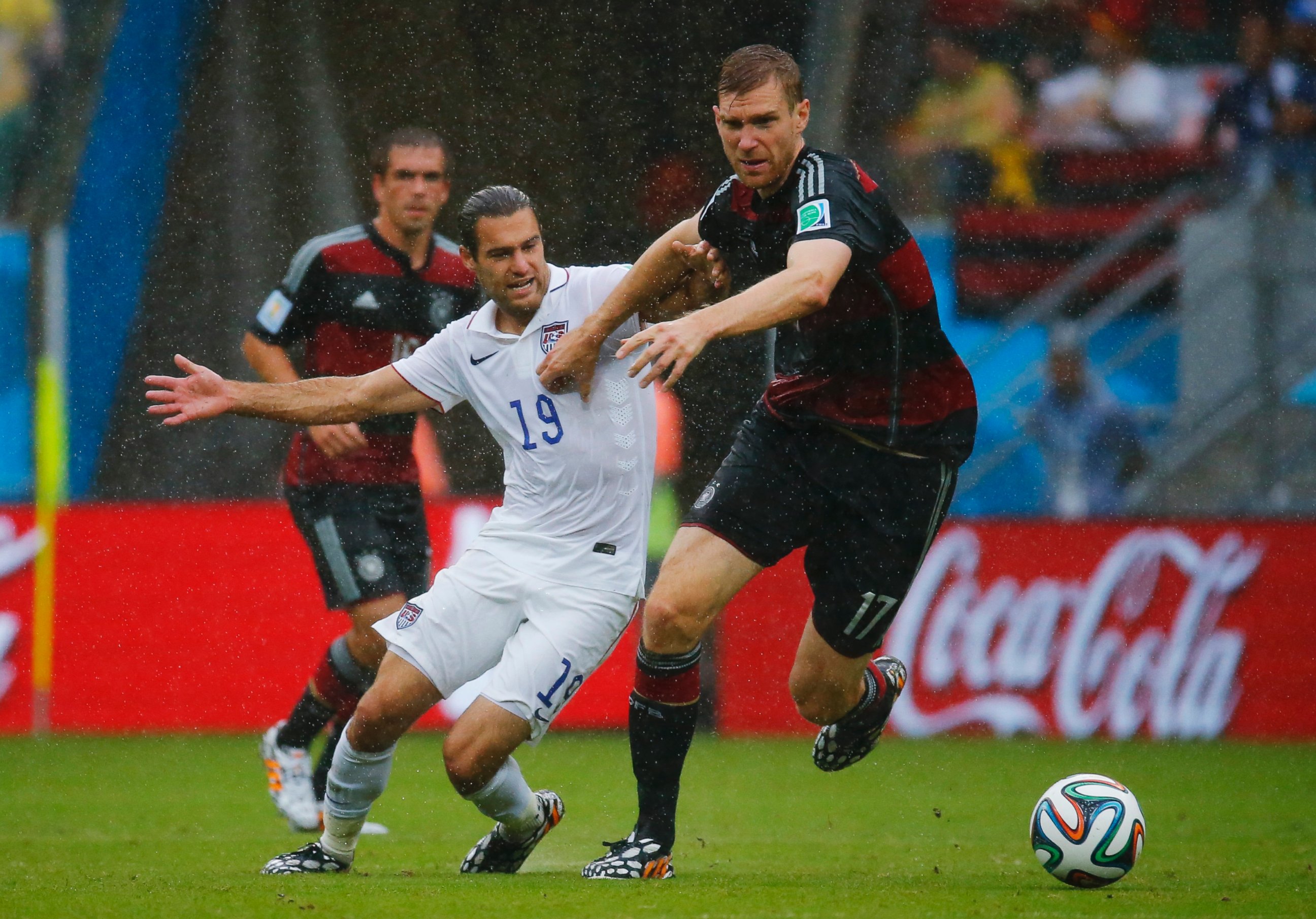 PHOTO: Graham Zusi of the U.S. fights for the ball with Germany's Per Mertesacker during their 2014 World Cup soccer match in Recife on June 26, 2014.