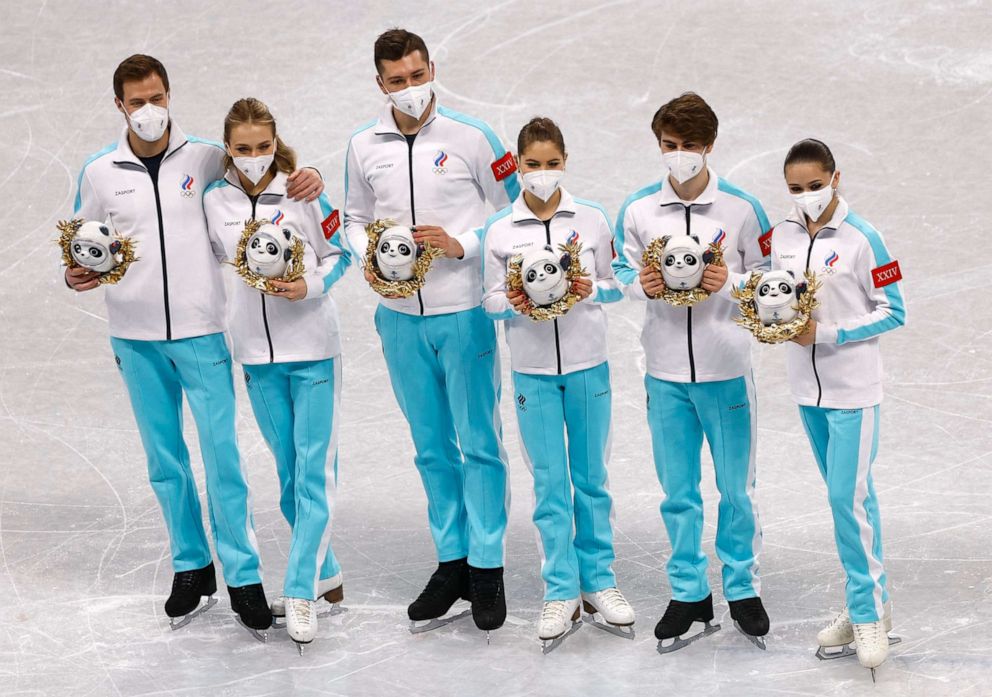 PHOTO:Kamila Valieva, Mark Kondratiuk, Anastasia Mishina, Aleksandr Galliamo, Nikita Katsalapov, Victoria Sinitsina of the Russian Olympic Committee celebrate during the flower ceremony at the 2022 Beijing Olympics in Beijing, Feb. 7, 2022.