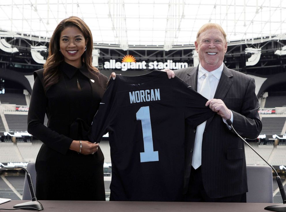 PHOTO: Sandra Douglass Morgan and owner and managing general partner Mark Davis of the Las Vegas Raiders pose with a jersey after a news conference introducing Morgan as the new President of the Raiders at Allegiant Stadium on July 7, 2022, in Las Vegas.