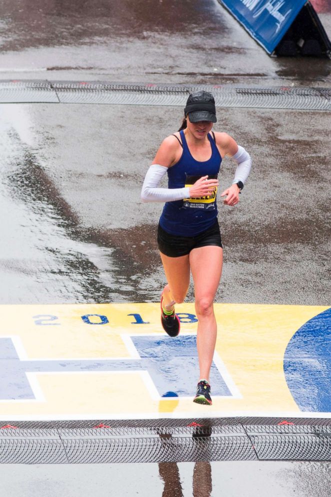 PHOTO: Sarah Sellers crosses the finish line in second place for the 122nd Boston Marathon, April 16, 2018, in Boston.