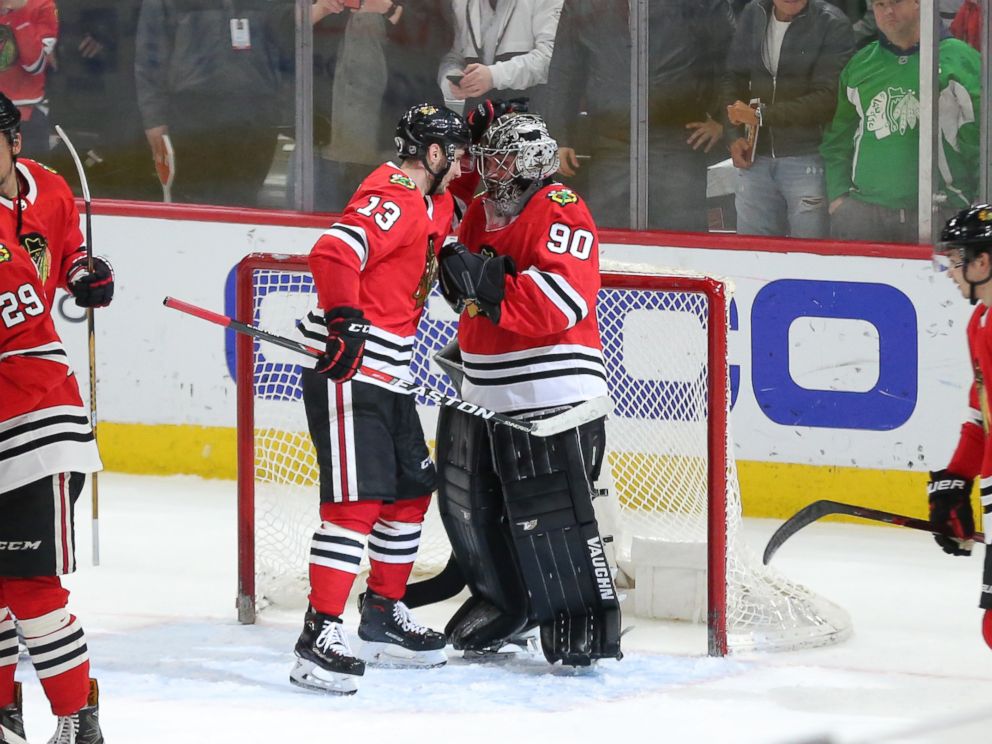 PHOTO: Chicago Blackhawks emergency goalie Scott Foster is congratulated by Tomas Jurco following the third period against the Winnipeg Jets at the United Center in Chicago, March 29, 2018.