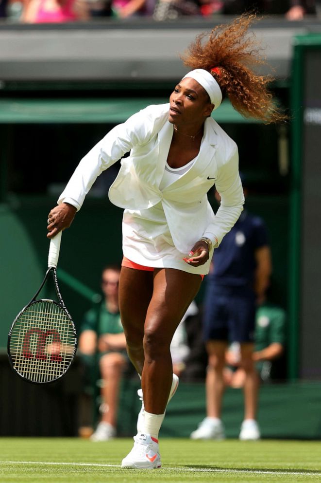 PHOTO: Serena Williams of the United States of America serves during the warm-up before her Ladies' Singles first round match on day two of the Wimbledon Lawn Tennis Championships at the All England Lawn Tennis and Croquet Club in London, June 25, 2013.