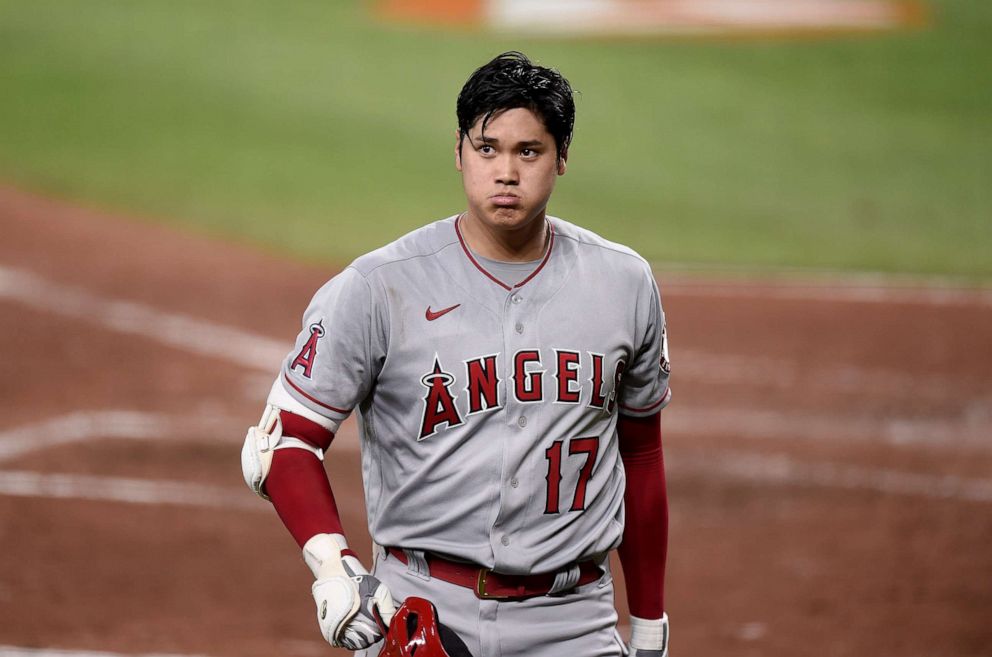 PHOTO: Shohei Ohtani walks to the dugout after striking out in the sixth inning against the Baltimore Orioles at Camden Yards, Aug. 25, 2021, in Baltimore, Maryland.