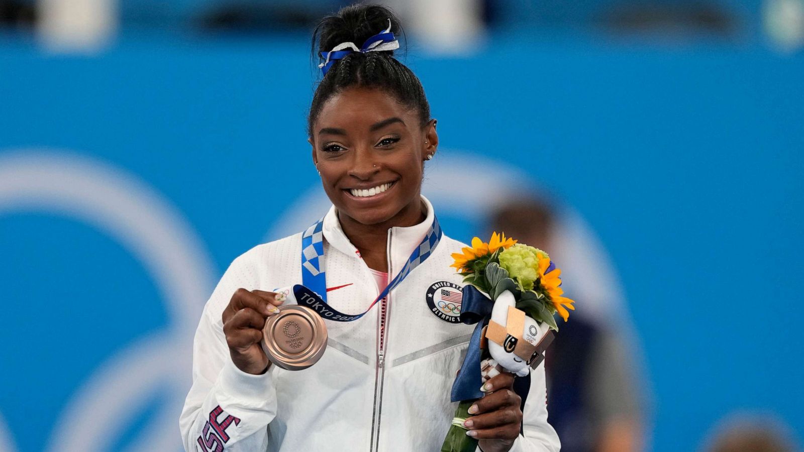 PHOTO: U.S. gymnast Simone Biles poses with her bronze medal for the artistic gymnastics women's balance beam apparatus at the 2020 Summer Olympics, Tuesday, Aug. 3, 2021, in Tokyo.