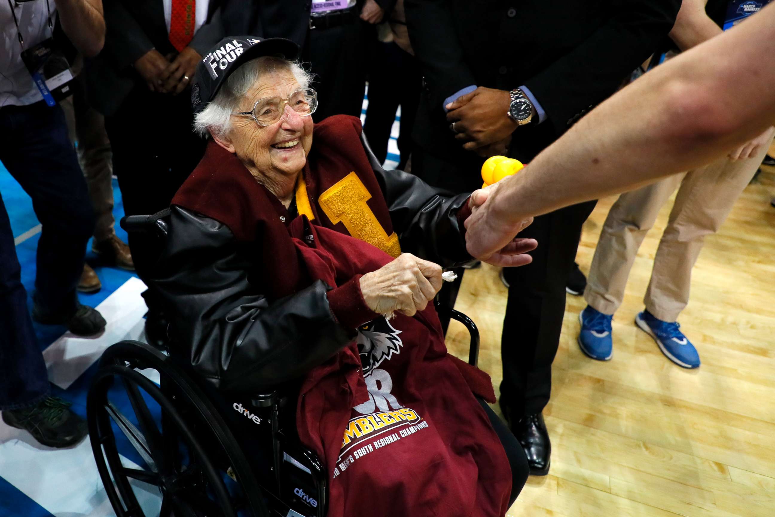 PHOTO: Sister Jean Dolores Schmidt celebrates with the Loyola Ramblers after defeating the Kansas State Wildcats during the 2018 NCAA Men's Basketball Tournament South Regional at Philips Arena, March 24, 2018, in Atlanta.
