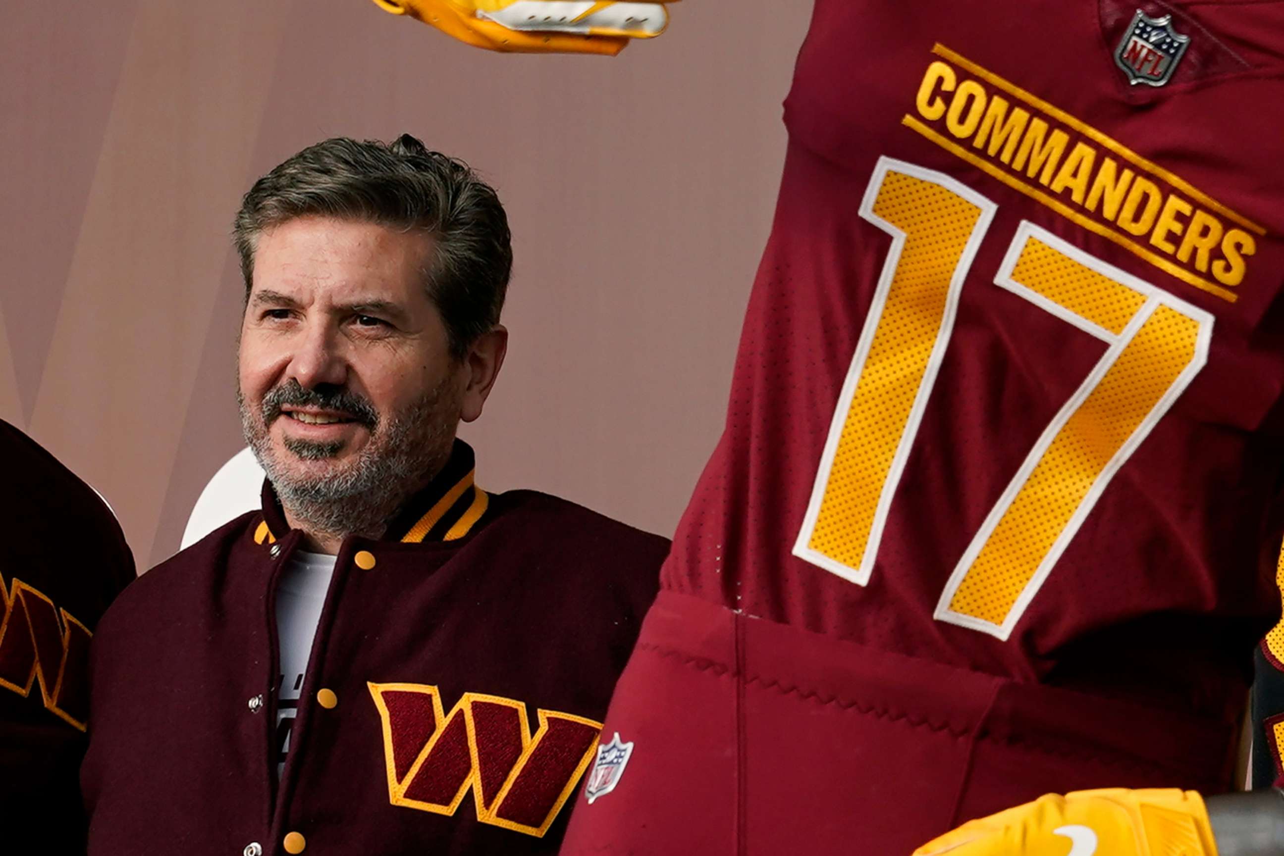 PHOTO: Washington Commanders' Dan Snyder poses for photos during an event to unveil the NFL football team's new identity, Feb. 2, 2022, in Landover, Md. 