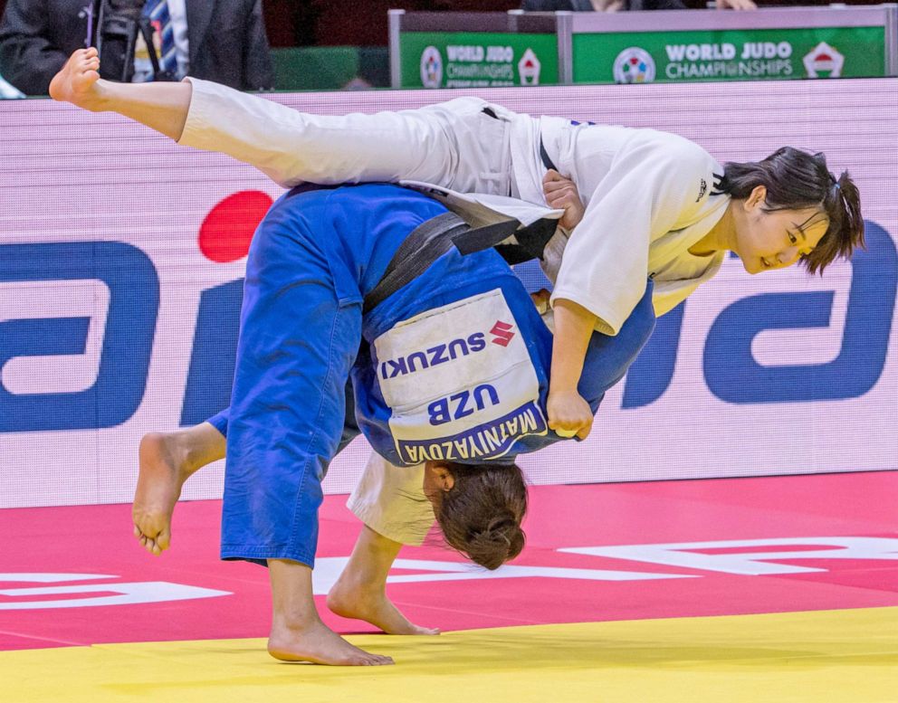 PHOTO: Heeju Han of South Korea and Gulnoza Matniyazova of Uzbekistan fight during their bronze bout in South Korea-Uzbekistan mixed team competition of 73kg category of World Judo Championships in Budapest, Hungary, Sunday, June 13, 2021.