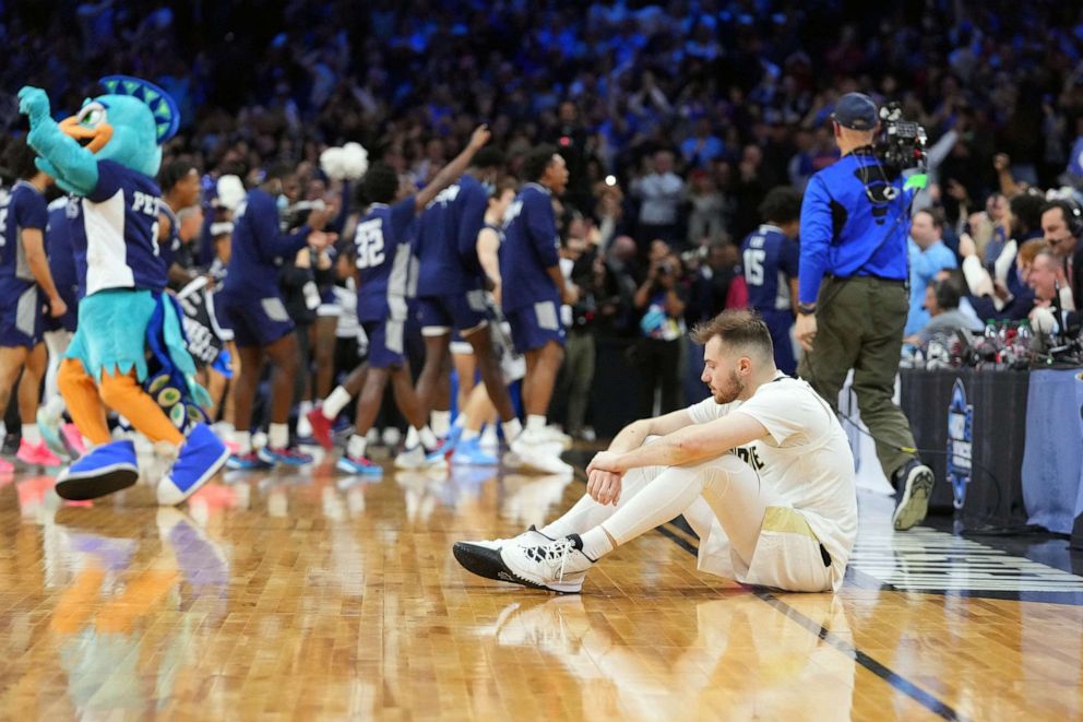 PHOTO: Purdue Boilermakers guard Sasha Stefanovic reacts after the St. Peter's Peacocks defeated the Purdue Boilermakers in the semifinals of the East regional of the men's college basketball NCAA Tournament in Philadelphia, on March 25, 2022.