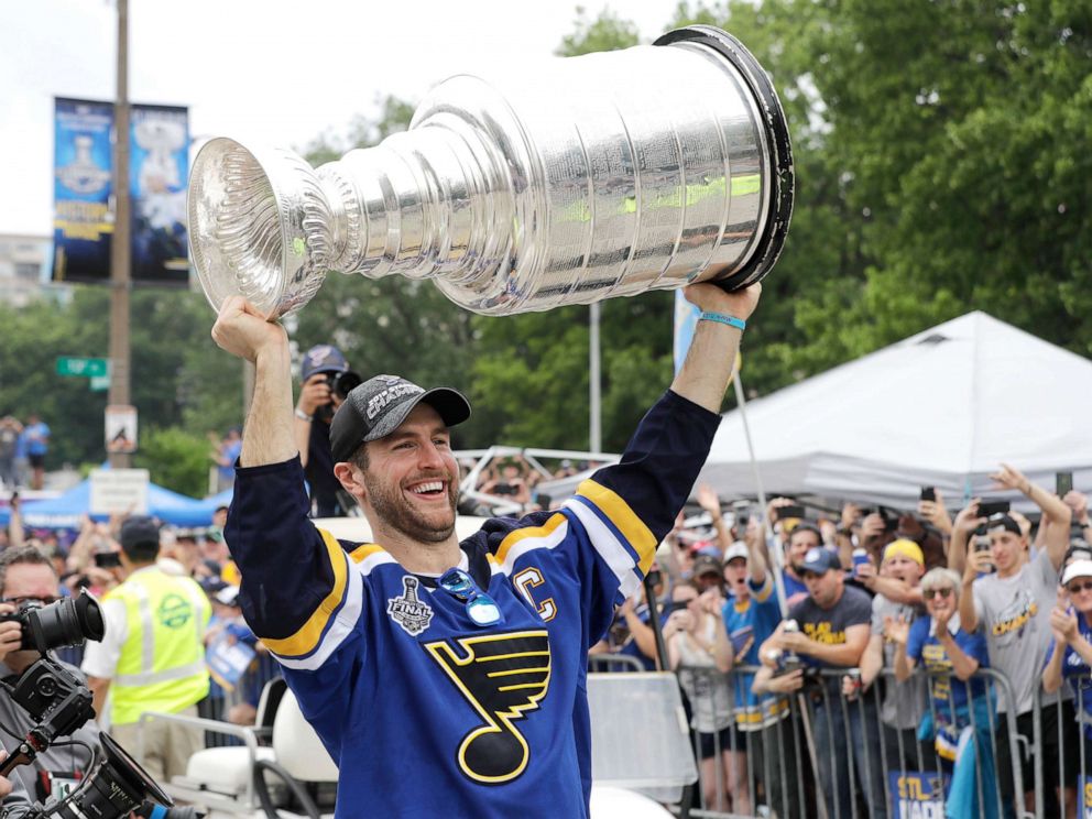 PHOTO: St. Louis Blues defenseman and captain Alex Pietrangelo carries the Stanley Cup during the  celebration.