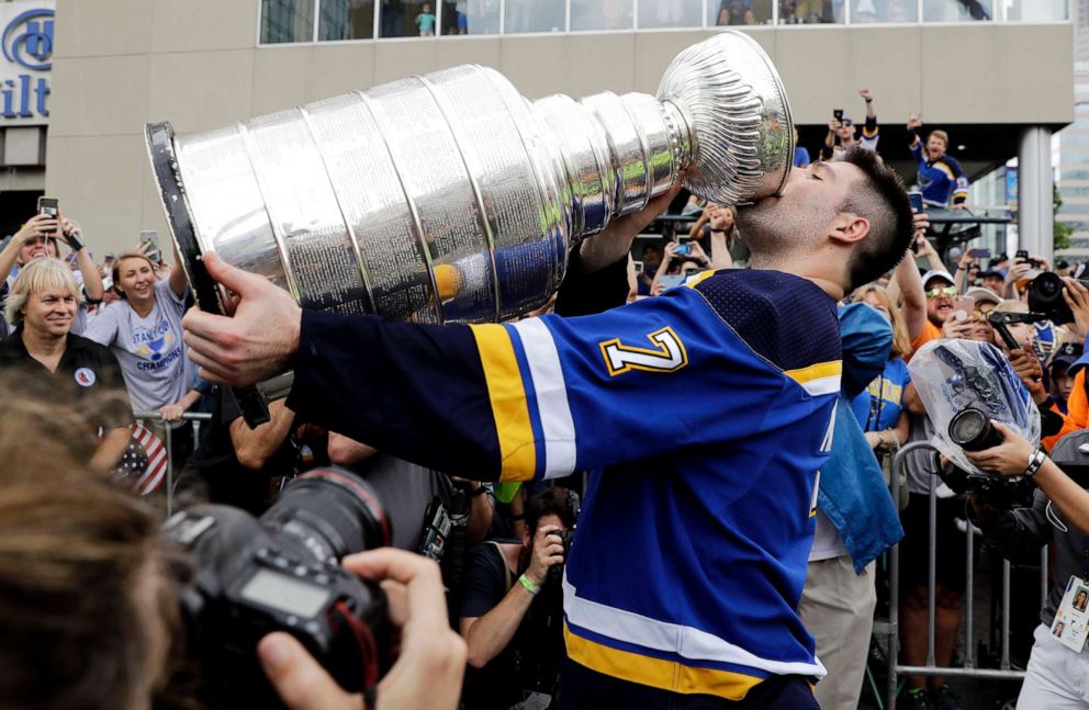 PHOTO: St. Louis Blues left wing Pat Maroon drinks from the Stanley Cup during the  victory celebration in St. Louis.