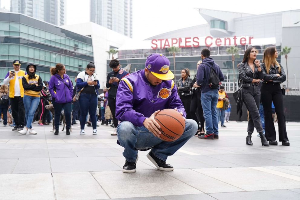 PHOTO: Flowers and tributes are left at a makeshift memorial for former NBA player Kobe Bryant outside the 62nd Annual GRAMMY Awards at STAPLES Center on Jan. 26, 2020, in Los Angeles. Bryant, 41, died today in a helicopter crash in near Calabasas, Calif.