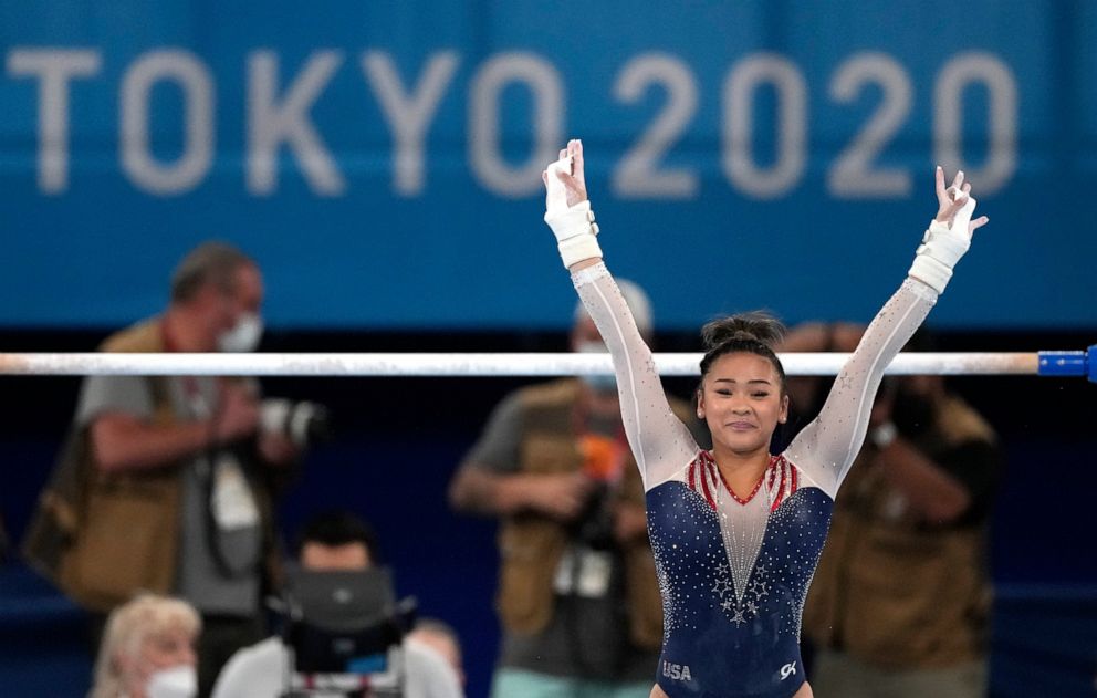 PHOTO: Sunisa Lee, of the United States, finishes on the uneven bars during the artistic gymnastics women's all-around final at the 2020 Summer Olympics, Thursday, July 29, 2021, in Tokyo.