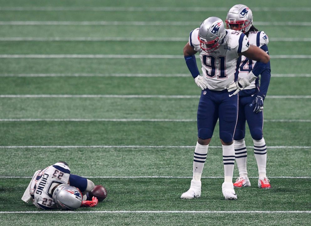 PHOTO: New England Patriots players look on as strong safety Patrick Chung (23) lays on the field after suffering an apparent injury during the third quarter of Super Bowl LIII against the Los Angeles Rams, Feb 3, 2019, in Atlanta.