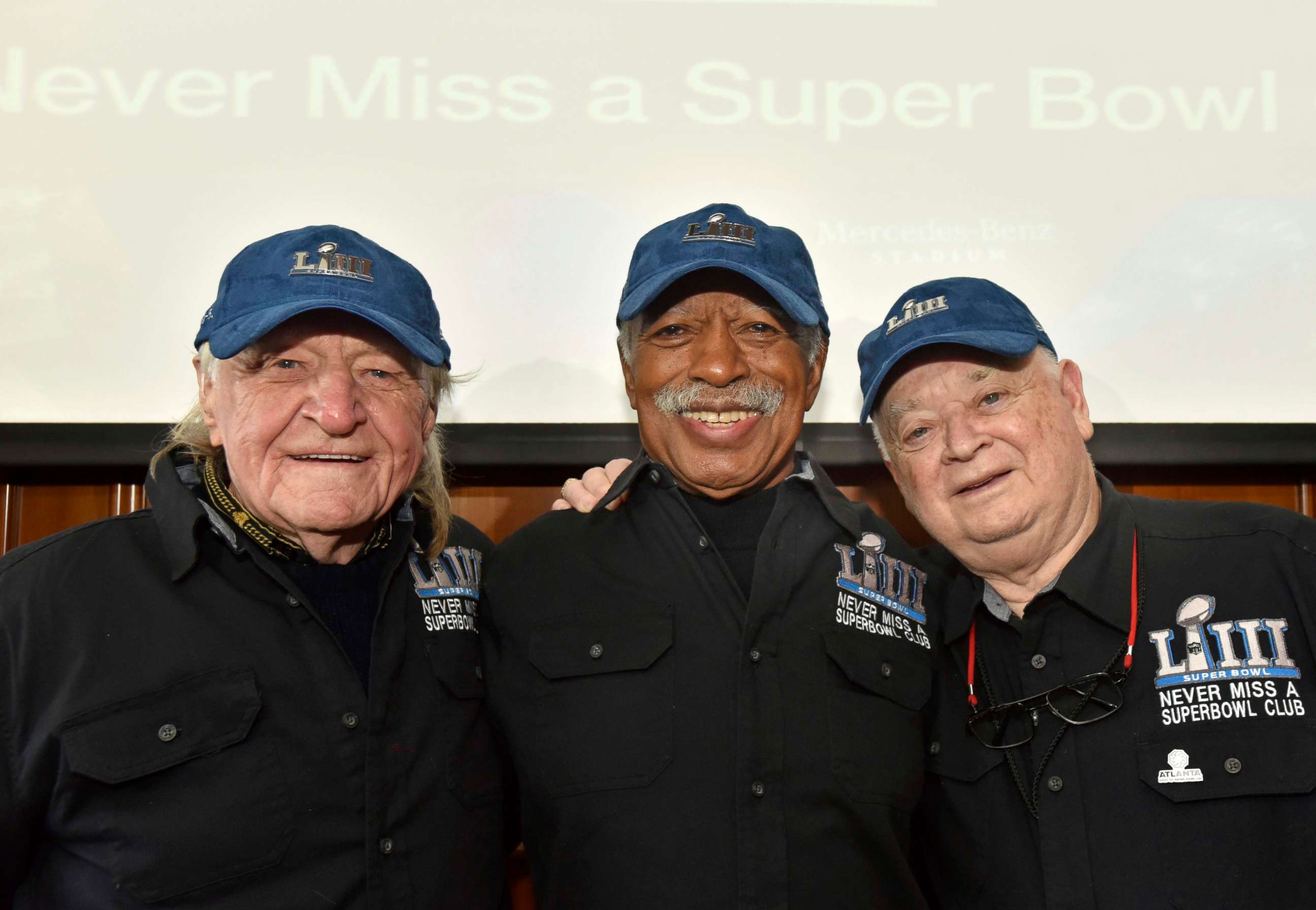 PHOTO: Members of the Never Miss a Super Bowl Club, from left, Tom Henschel, Gregory Eaton and Don Crisman pose for a group photograph during a welcome luncheon in Atlanta, Feb. 1, 2019.