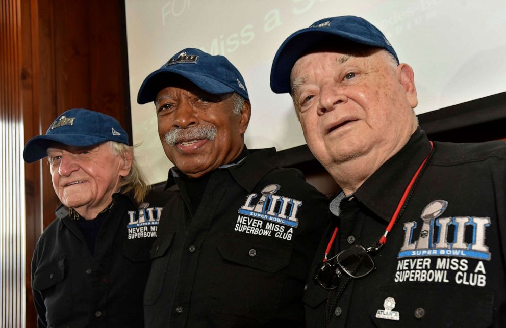 PHOTO: Members of the Never Miss a Super Bowl Club, from the left, Tom Henschel, Gregory Eaton, and Don Crisman pose for a group photograph during a welcome luncheon, in Atlanta, Feb. 1, 2019.