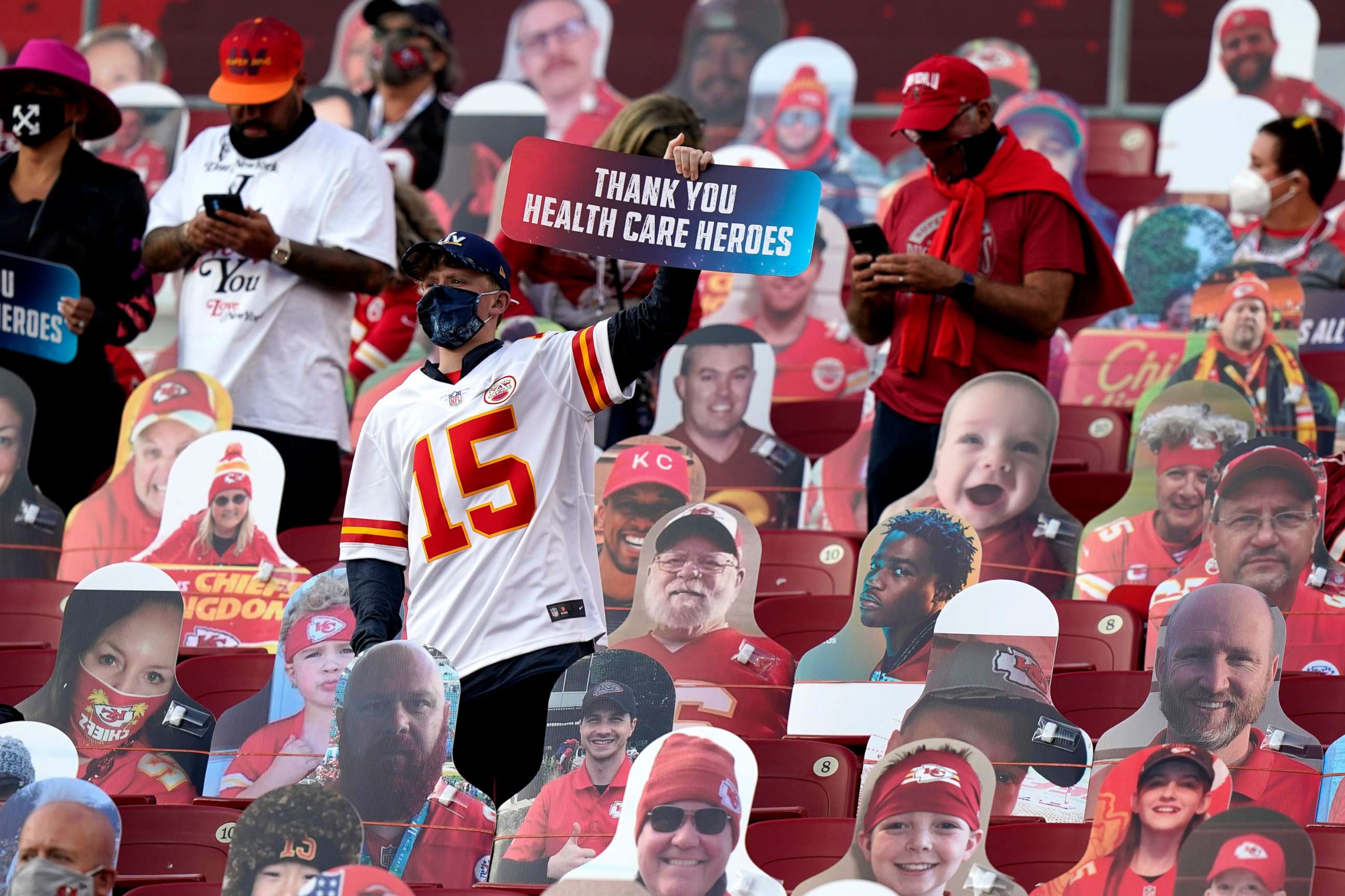 PHOTO: A fan holds up a sign honoring heart care workers before the NFL Super Bowl 55 football game between the Kansas City Chiefs and Tampa Bay Buccaneers, Feb. 7, 2021, in Tampa, Fla.