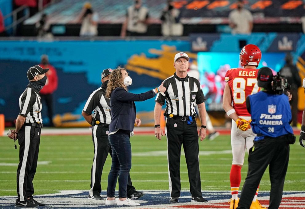 PHOTO: Health care worker Suzie Dorner tosses the coin before the NFL Super Bowl 55 football game between the Tampa Bay Buccaneers and the Kansas City Chiefs, Feb. 7, 2021, in Tampa, Fla. 