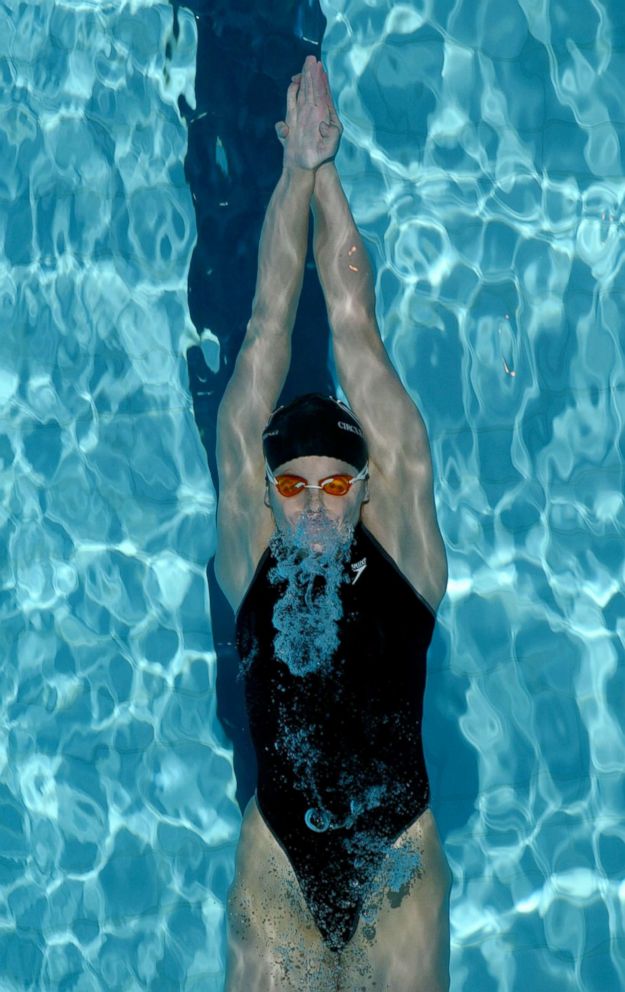 PHOTO: Susan Woessner swims in the preliminary heats of the women's 100M backstroke during the US Swimming National Championships at the IU Natatorium, April 4, 2003, in Indianapolis, Indiana.