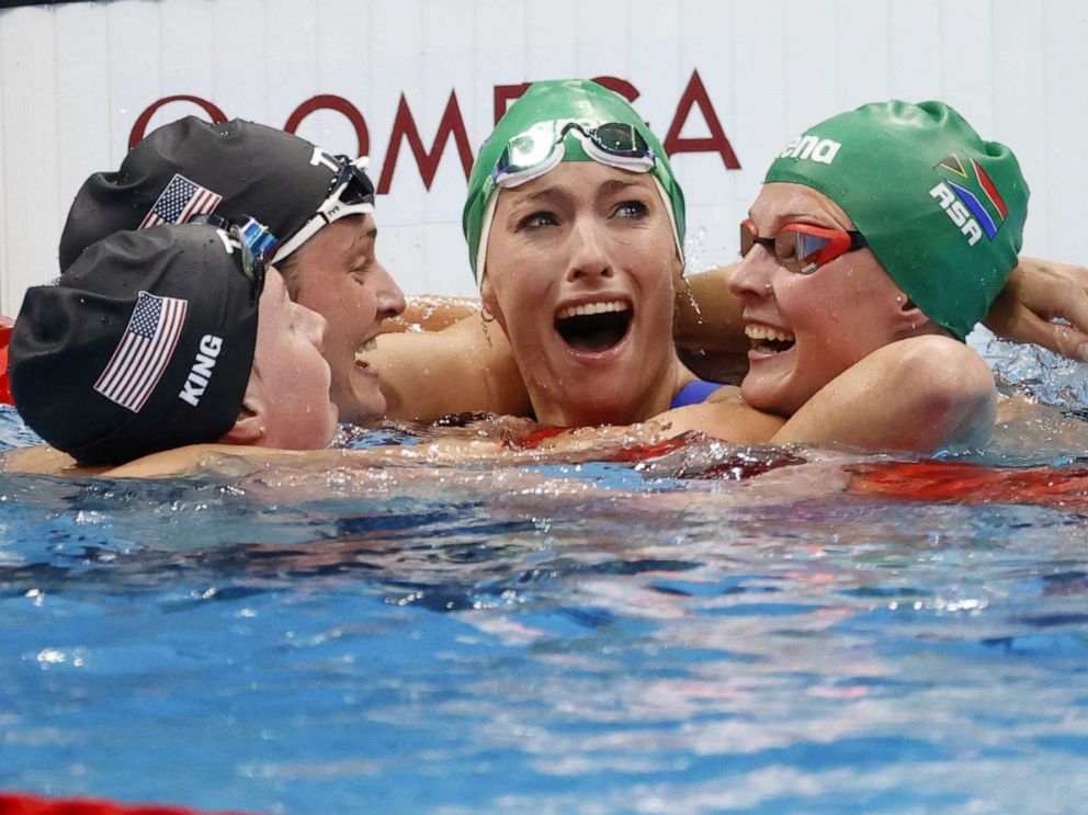 PHOTO: Tatjana Schoenmaker (2nd R), after her World Record time in the Women's 200m breastroke final, is congratulated by Lilly King and Annie Lazor of the U.S., and Kaylene Corbett of South Africa at the Tokyo 2020 Olympic Games in Tokyo, July 30, 2021.