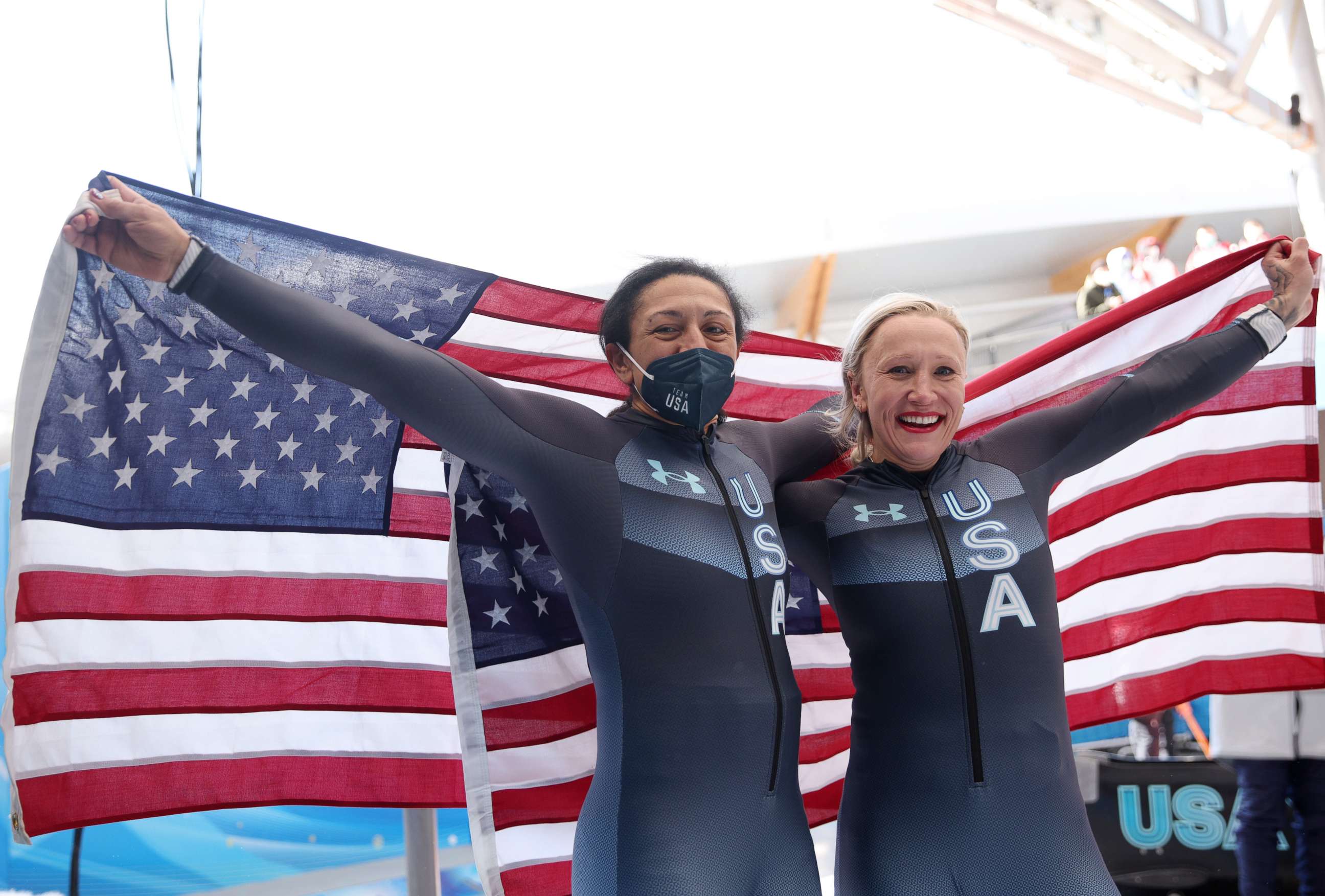 PHOTO: Gold medallist Kaillie Humphries, right, and silver medallist Elana Meyers Taylor, both of the United States, left, celebrate during the women's monobob during the 2022 Winter Olympics at National Sliding Centre on Feb. 14, 2022, in Yanqing, China.