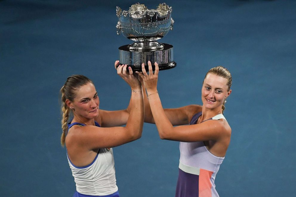 PHOTO: In this file photo taken on Jan. 31, 2020 Hungary's Timea Babos, left, and France's Kristina Mladenovic, right, pose with the trophy after their victory during the women's doubles final at the Australian Open tennis tournament in Melbourne.