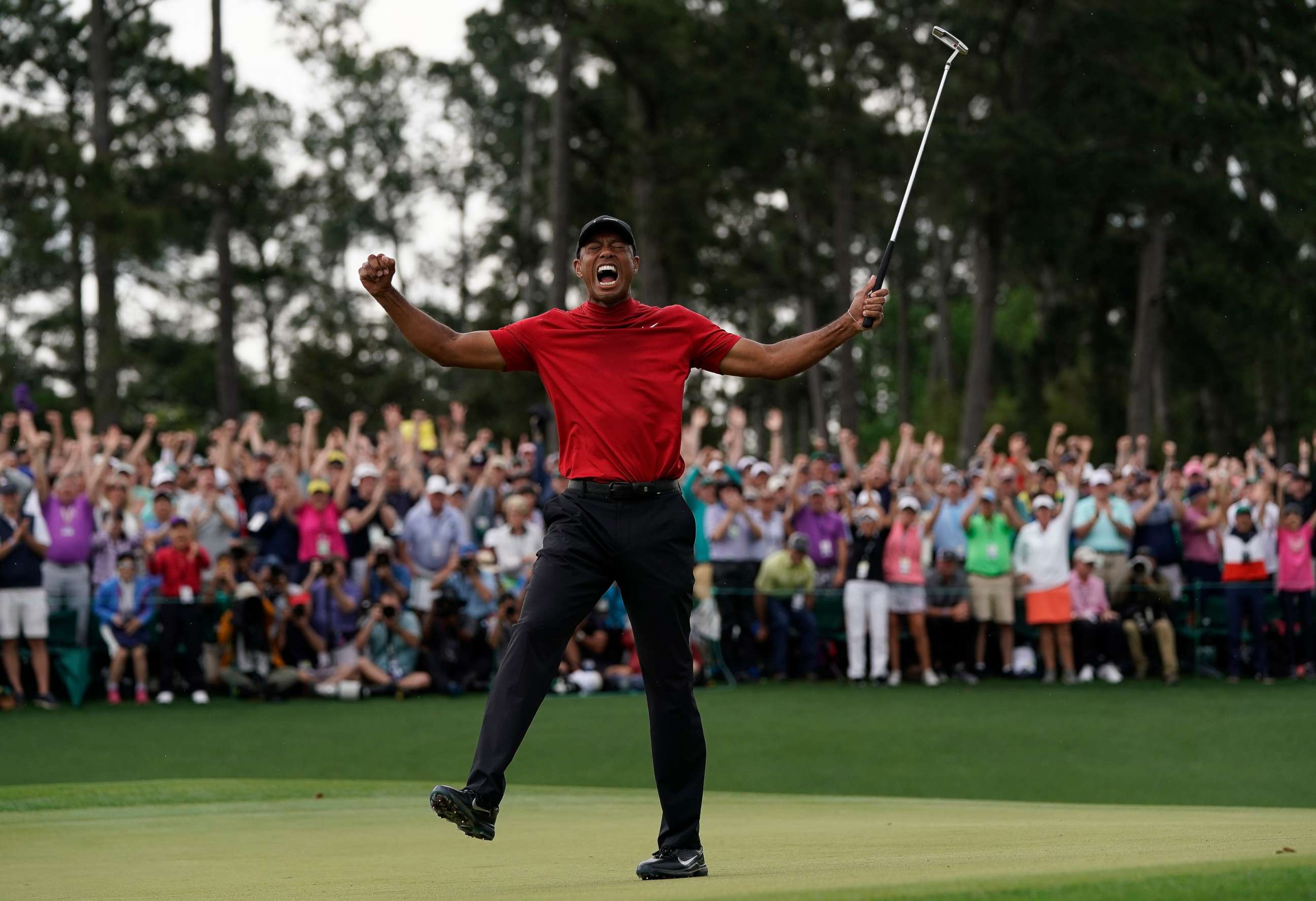 PHOTO: Tiger Woods reacts as he wins the Masters golf tournament, April 14, 2019, in Augusta, Ga.