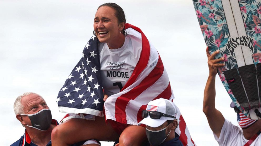 PHOTO: Carissa Moore celebrates after winning the women's Surfing gold medal final at the Tsurigasaki Surfing Beach, in Chiba, on July 27, 2021 during the Tokyo 2020 Olympic Games.