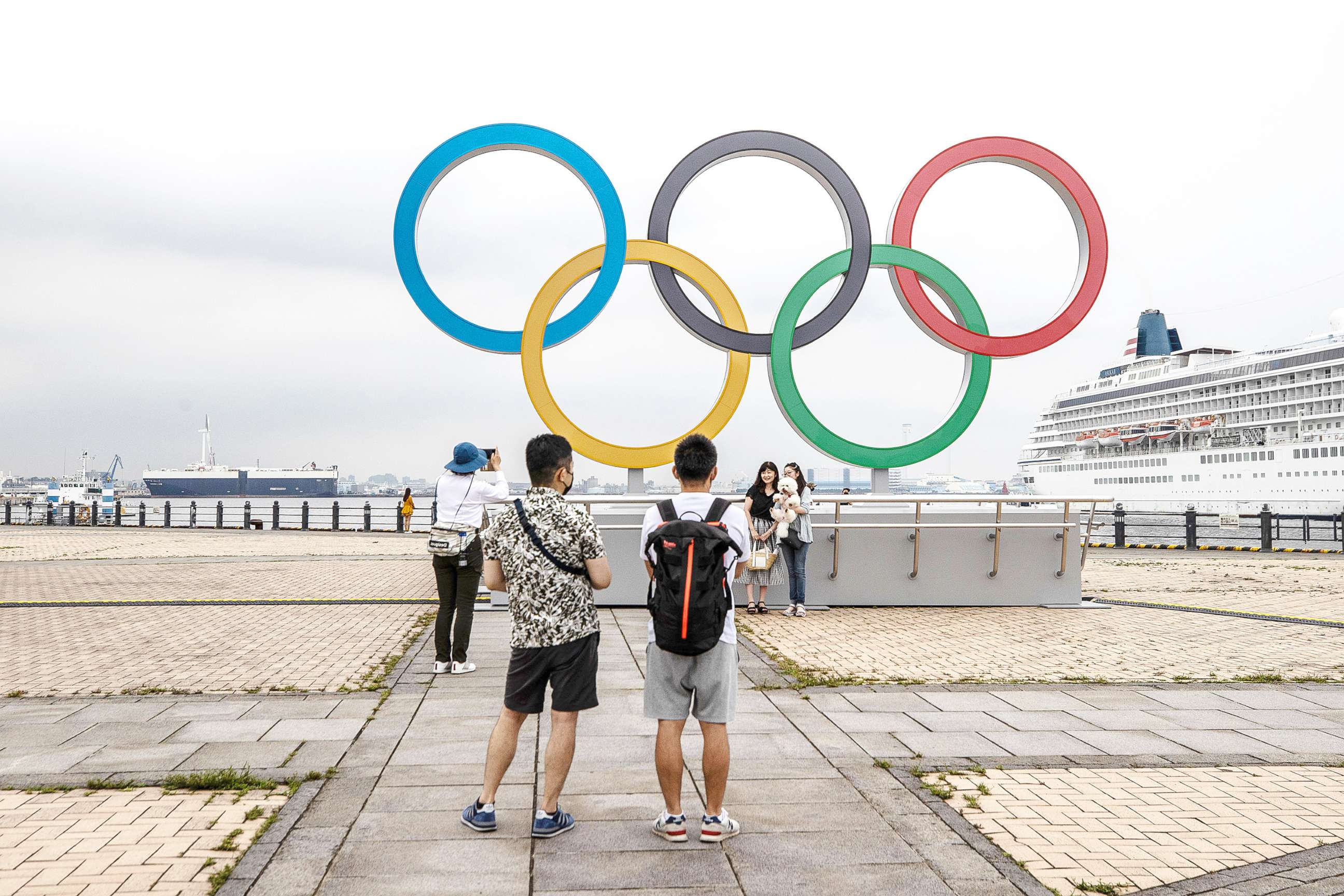 PHOTO: People take photographs of the Olympic Rings at Akarenga Park on June 30, 2021 in Yokohama, Japan.