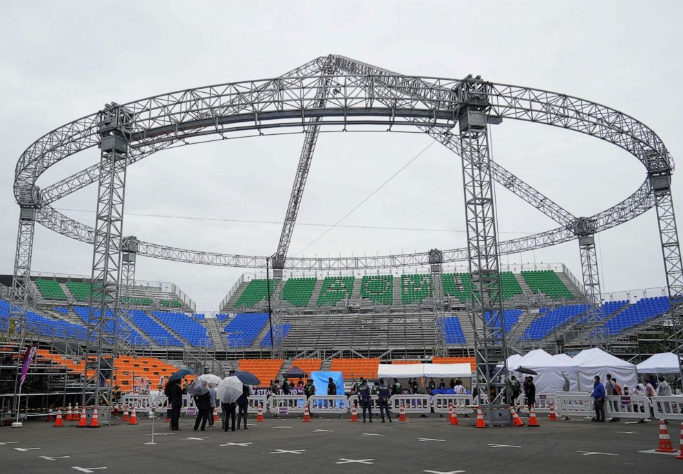 PHOTO: People stand in the venue for the 3x3 basketball event at the Tokyo 2020 Olympics at Aomi Urban Sports Park in Tokyo, Japan, May 16, 2021.