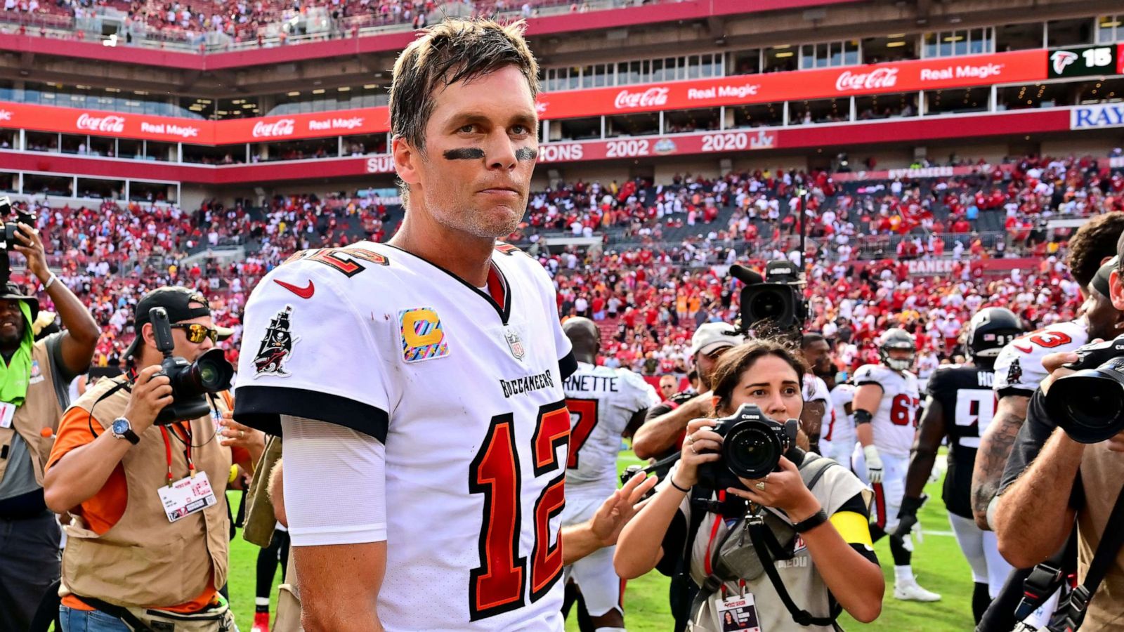 PHOTO: Tom Brady of the Tampa Bay Buccaneers walks off the field after defeating the Atlanta Falcons, 21-15, at Raymond James Stadium on Oct. 9, 2022 in Tampa, Fla.
