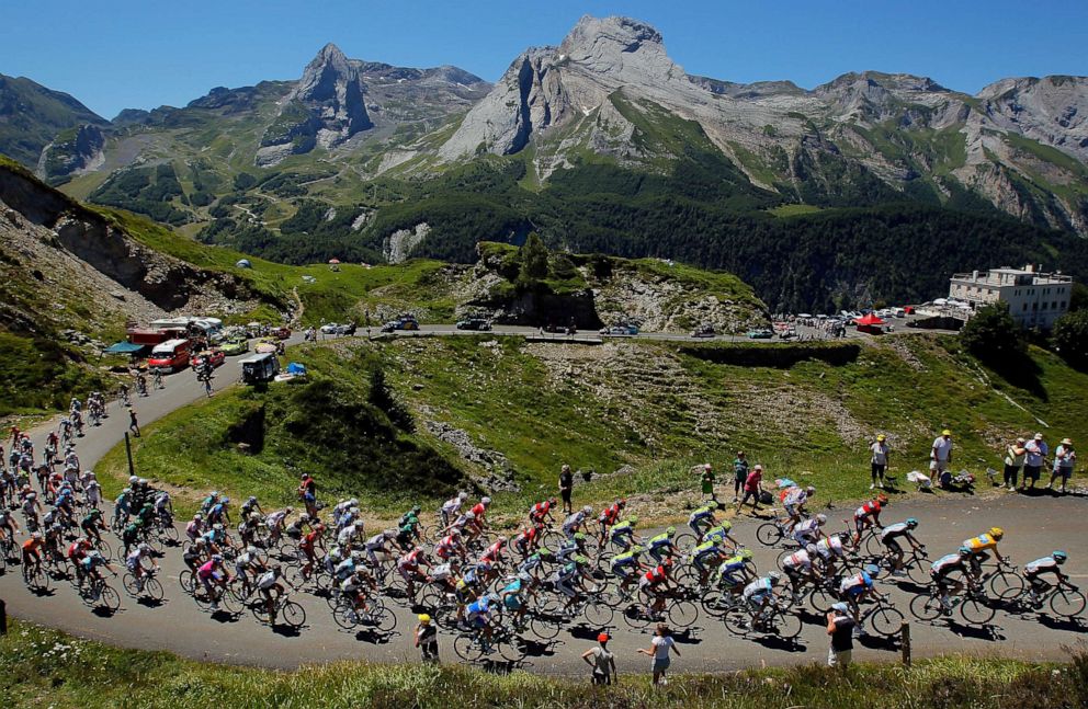 PHOTO: Team Sky Procycling leads the peloton on the climb of the Col d'Aubisque during stage 16 of the 2012 Tour de France from Pau to Bagneres-de-Luchon, on July 18, 2012, in Gourette, France.