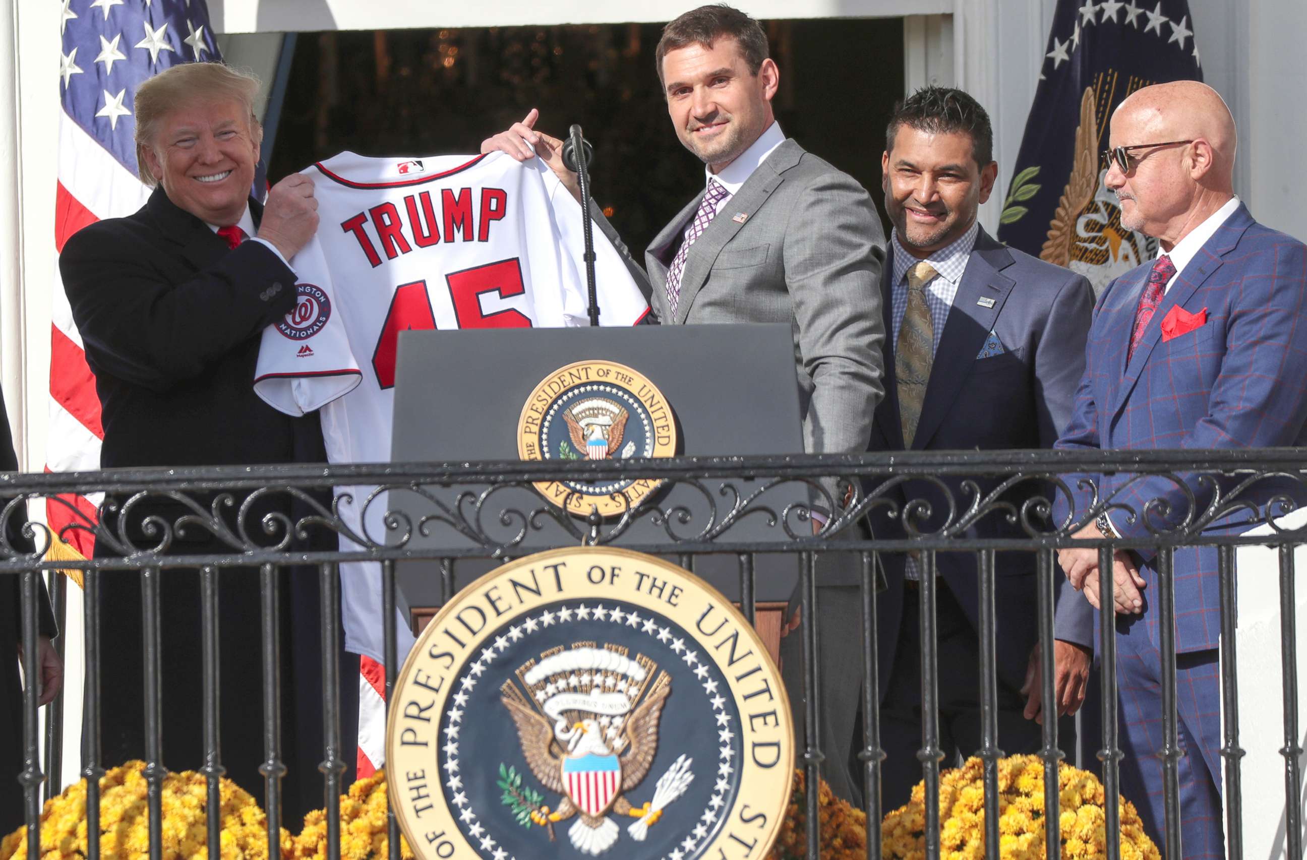 PHOTO: President Donald Trump holds up a Washington Nationals jersey given to him by Nationals first baseman Ryan Zimmerman during a celebration in honor of the team's victory in the 2019 World Series at the White House, Nov. 4, 2019. 