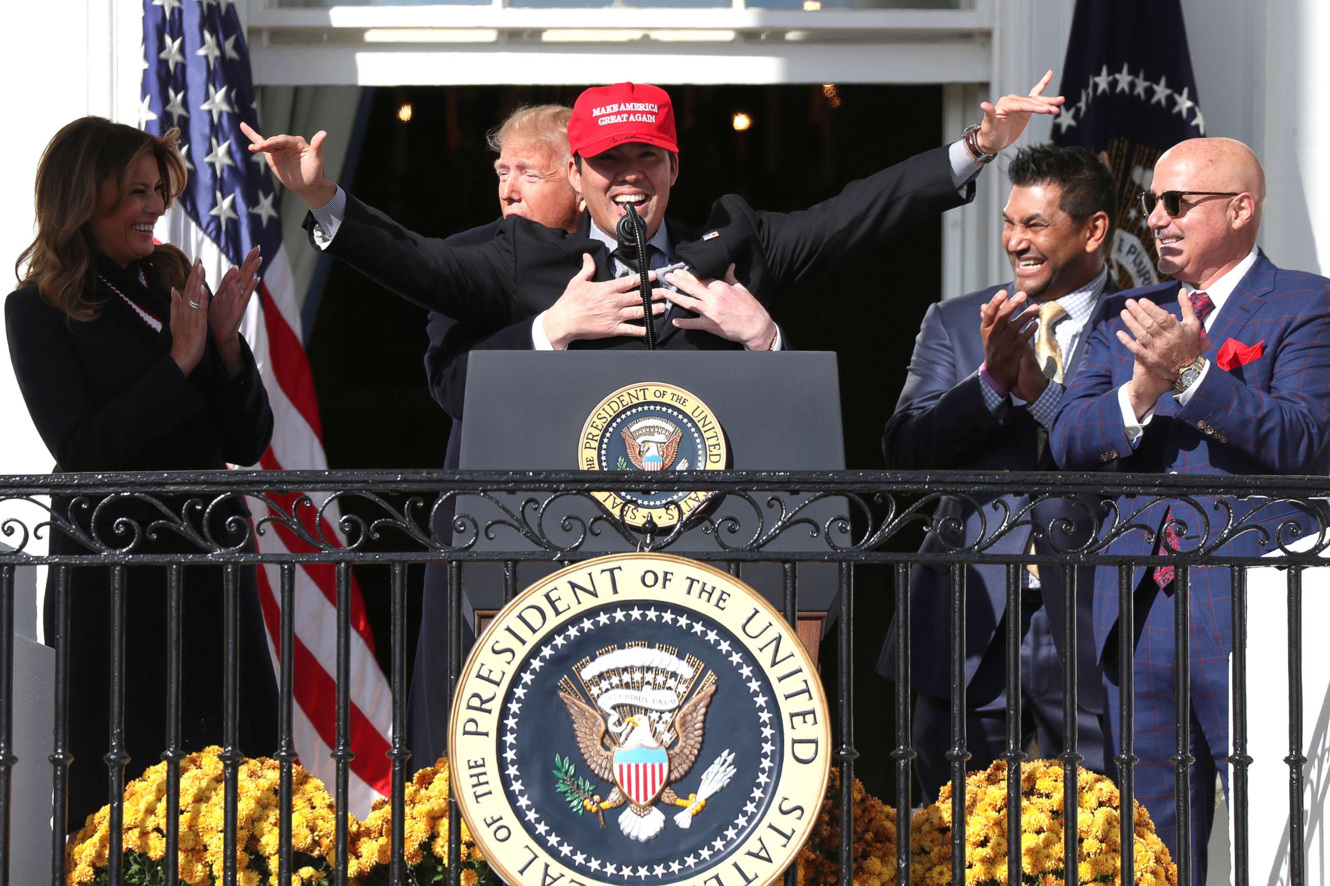 PHOTO: President Donald Trump embraces Washington Nationals catcher Kurt Suzuki during an event to honor the 2019 World Series champion Washington Nationals on the South Lawn of the White House, Nov. 4, 2019.