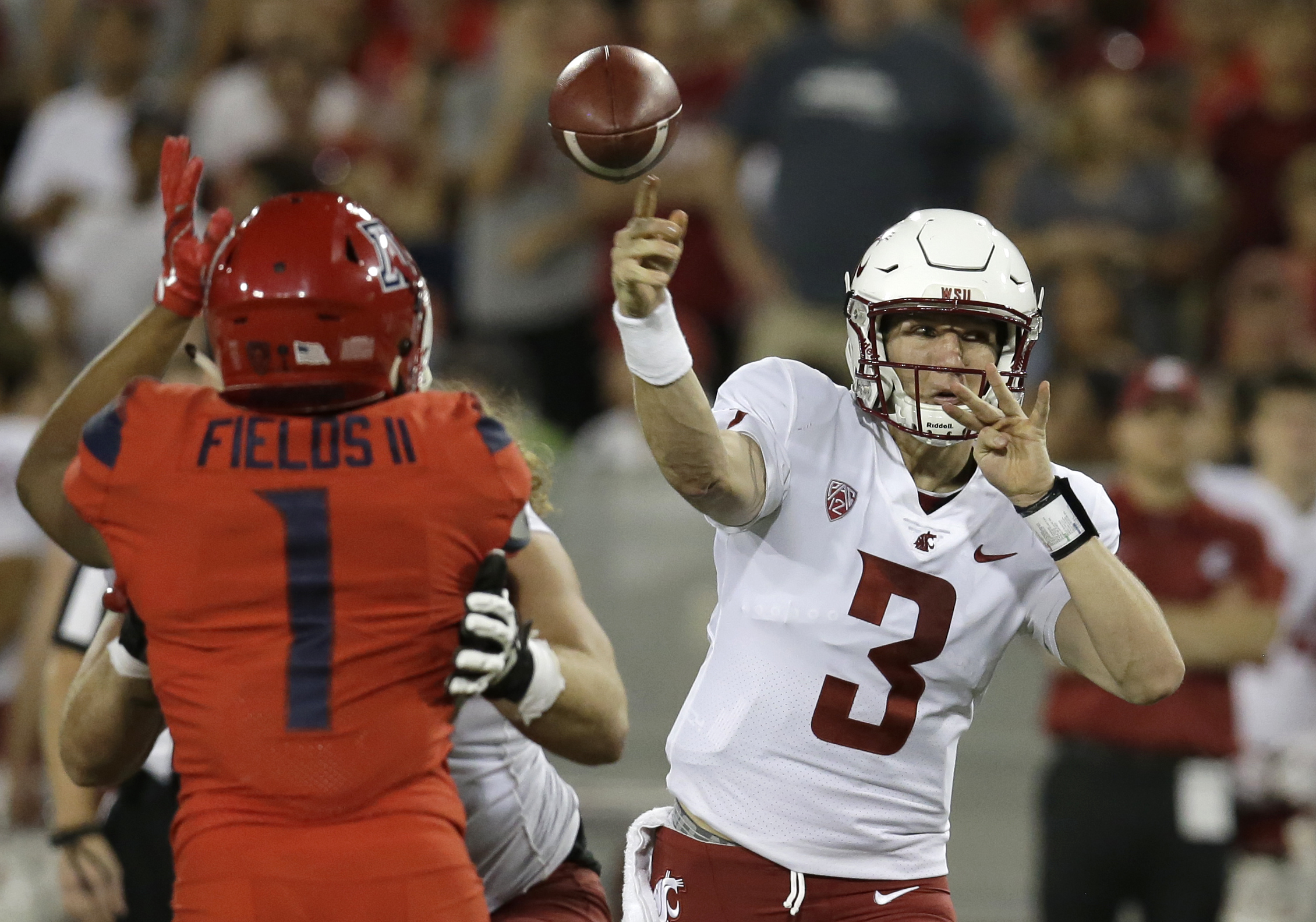PHOTO: Washington State quarterback Tyler Hilinski (3) throws down field for a first down against Arizona in the second half during an NCAA college football game, Oct. 28, 2017, in Tucson, Ariz. 