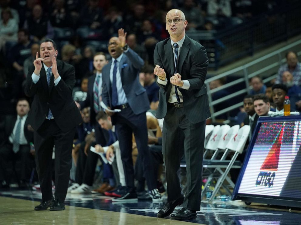 PHOTO: In this Jan 29, 2020, file photo, Connecticut Huskies head coach Dan Hurley (right) and his coaching staff watch from the sideline as they take on the Temple Owls in the first half at Harry A. Gampel Pavilion in Storrs, Conn.