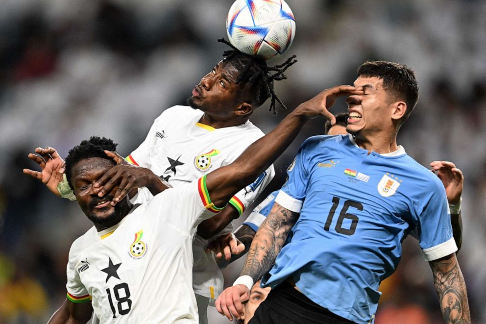 PHOTO: Ghana's defender Daniel Amartey, Ghana's defender Mohammed Salisu and Uruguay's defender Mathias Olivera fight for a header during the World Cup football match between Ghana and Uruguay in Al-Wakrah, south of Doha on Dec. 2, 2022.