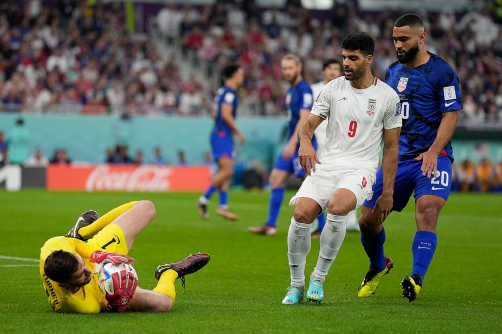 PHOTO: Goalkeeper Matt Turner of the United States saves the ball during the World Cup group B soccer match between Iran and the United States at the Al Thumama Stadium in Doha, Qatar, Tuesday, Nov. 29, 2022